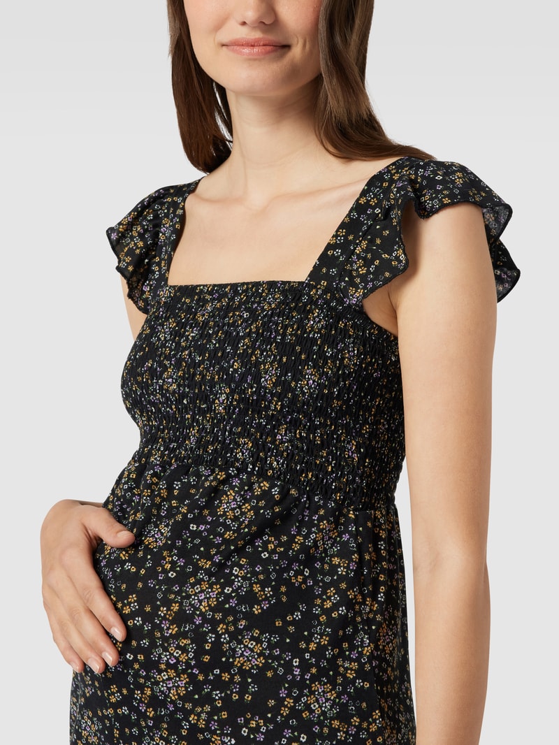 Umstands-Jumpsuit mit floralem Muster in schwarz