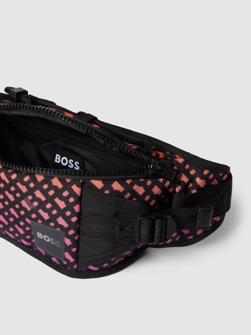 Bauchtasche mit Allover-Logo Modell 'Bumbag' - BOSS x Khaby 2.0 in dunkel orange