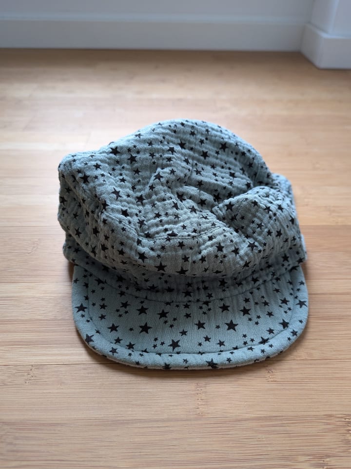 Sterntaler Wende-Nackenschutzcap in Grün - ungetragen! günstig kaufen 53 cm