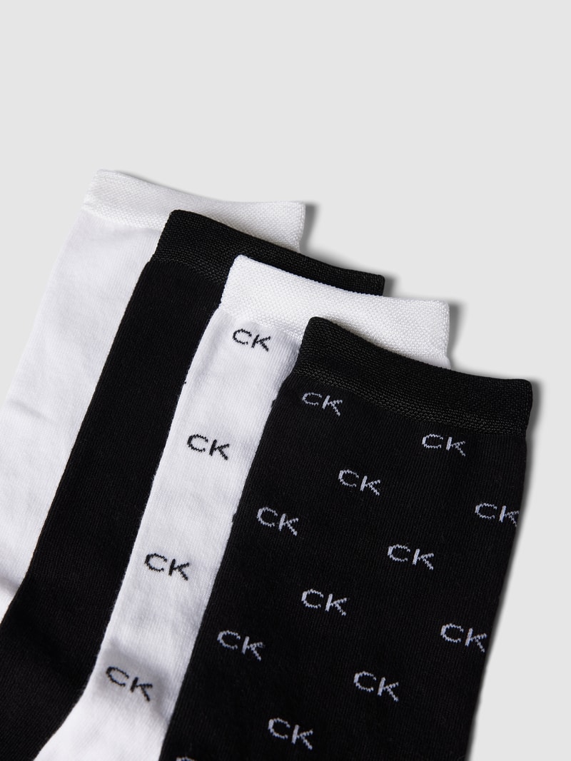 Socken mit elastischen Abschlüssen im 4er-Pack in schwarz