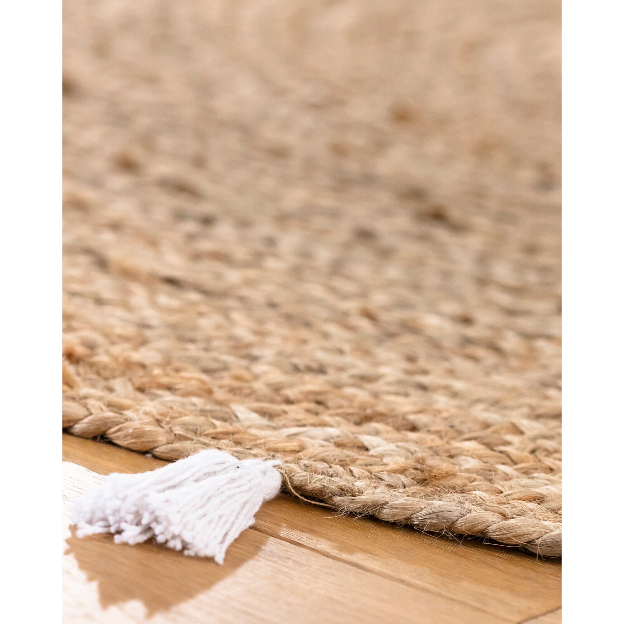 Tapis rond en jute avec pompons de couleur