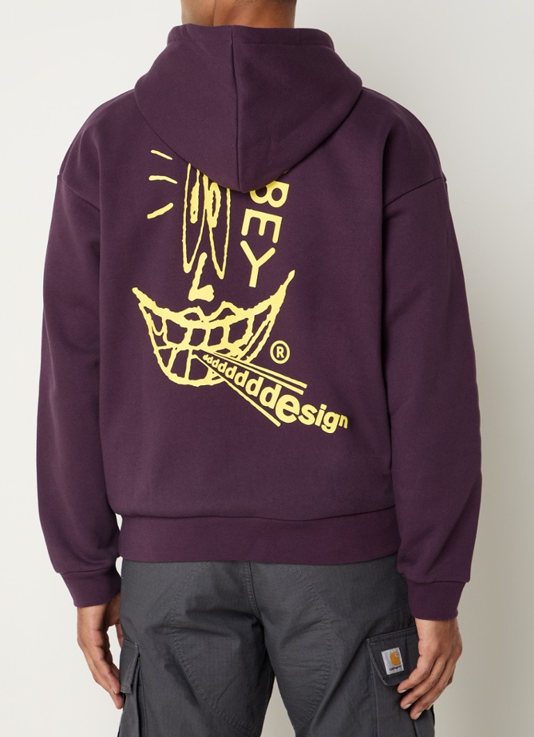 Obey Extra Heavy -huppari logolla ja takapainatuksella
