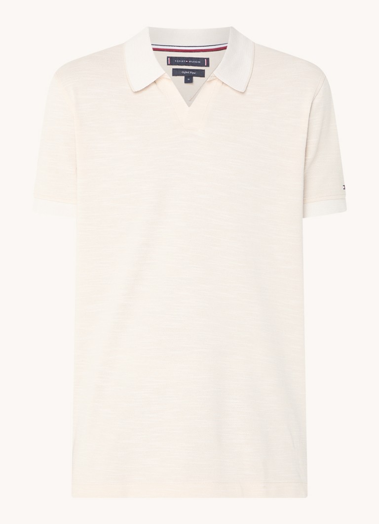 Polo Tommy Hilfiger Mouline de corte regular, confeccionada em algodão piqué.