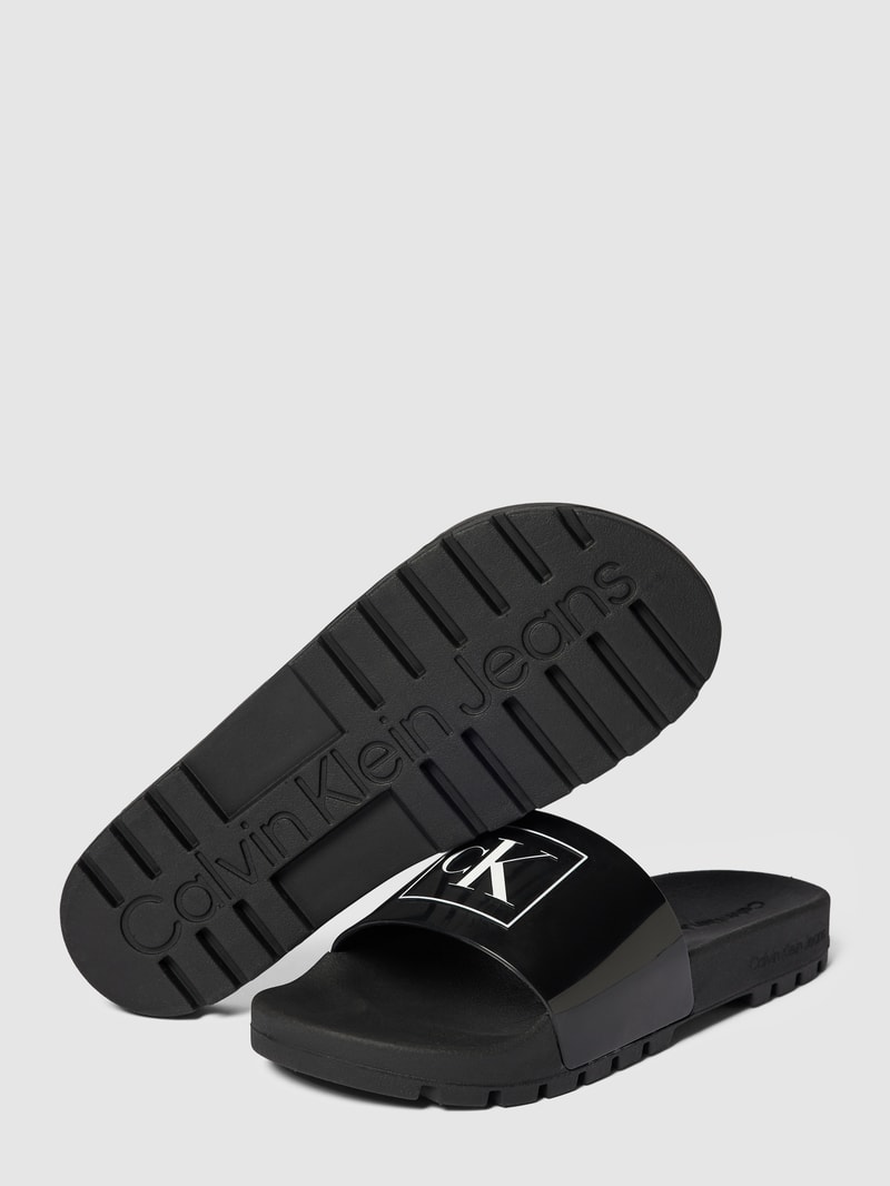 Slides mit Logo-Print Modell 'TRUCK' in schwarz