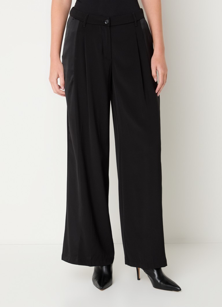 Pantaloni de vară cu talie înaltă, cu talie lată și buzunare laterale.