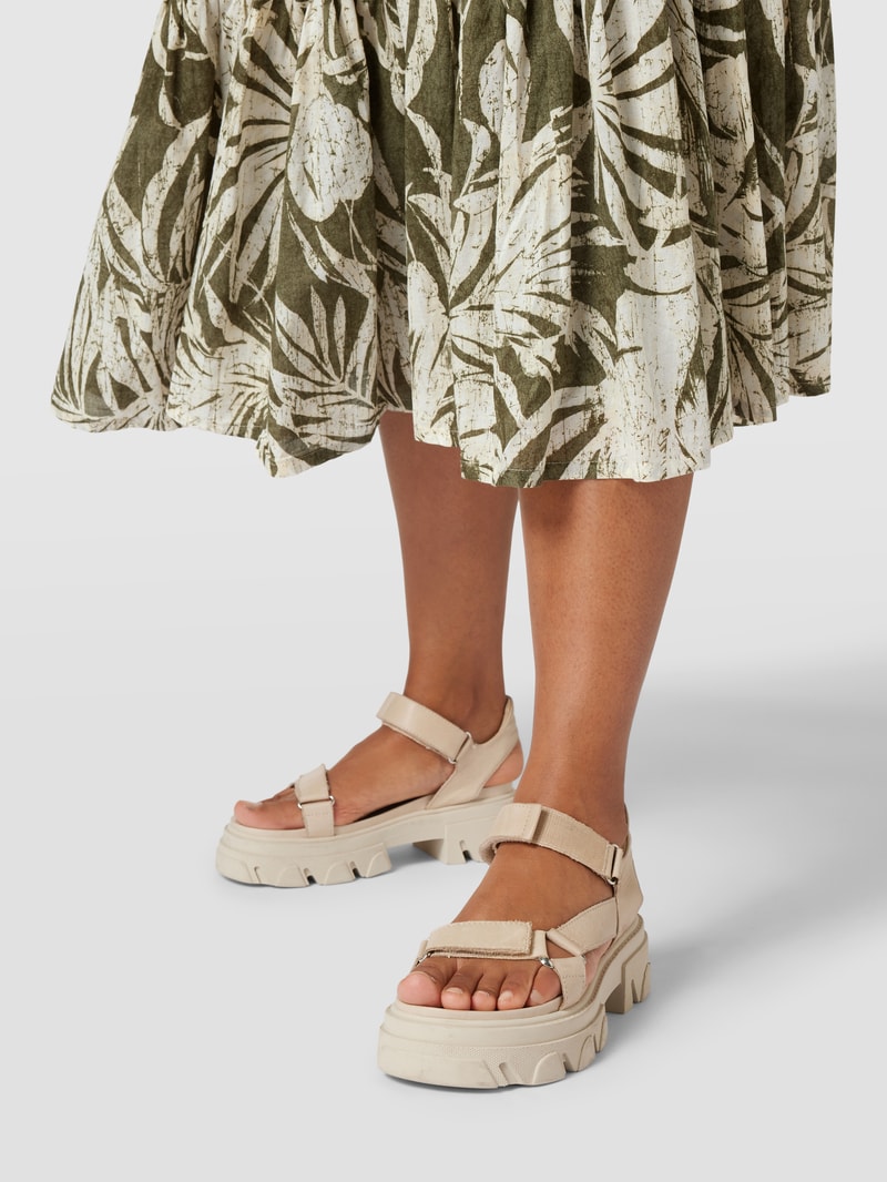 PLUS SIZE Midirock mit floralem Muster in olivgrün