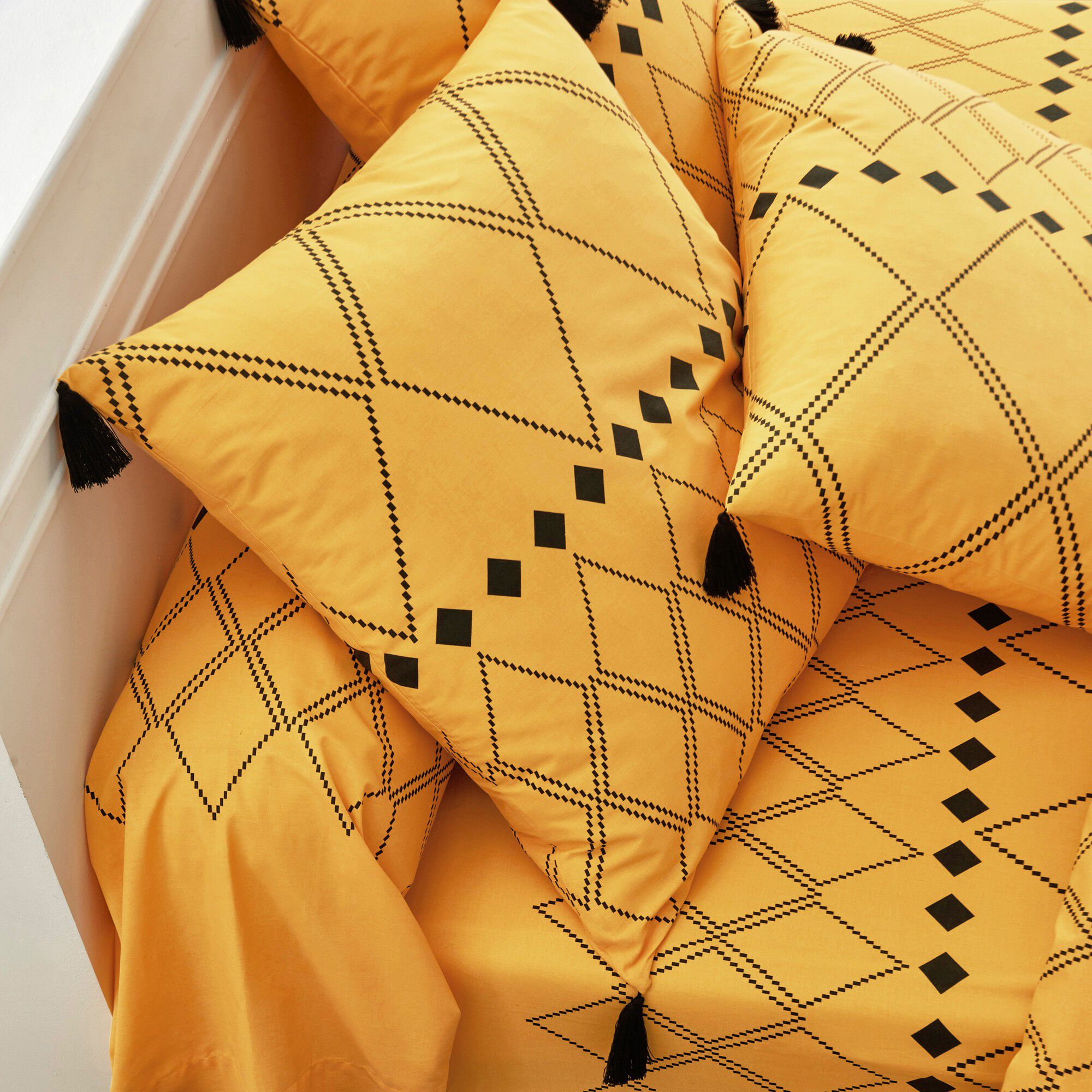 Linge de lit Massaï coton à motifs graphiques et finitions pompons