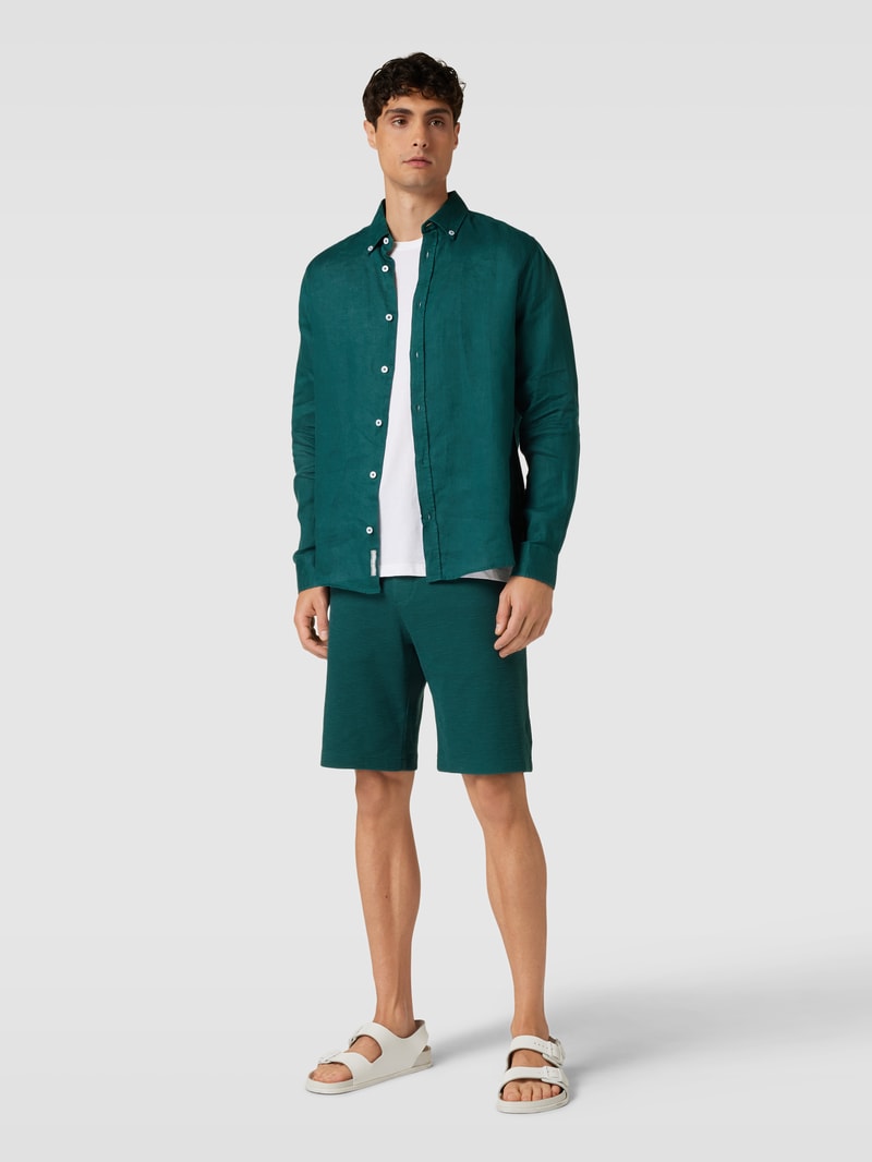 Shorts in unifarbenem Design Modell 'Waffle' in petrol