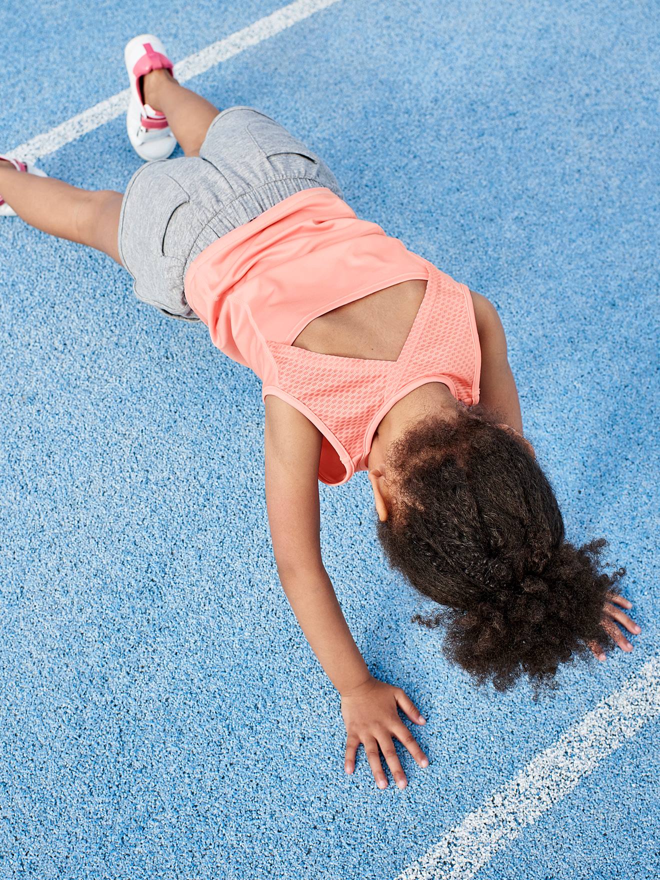 Débardeur sport fille inscription irisée rose clair