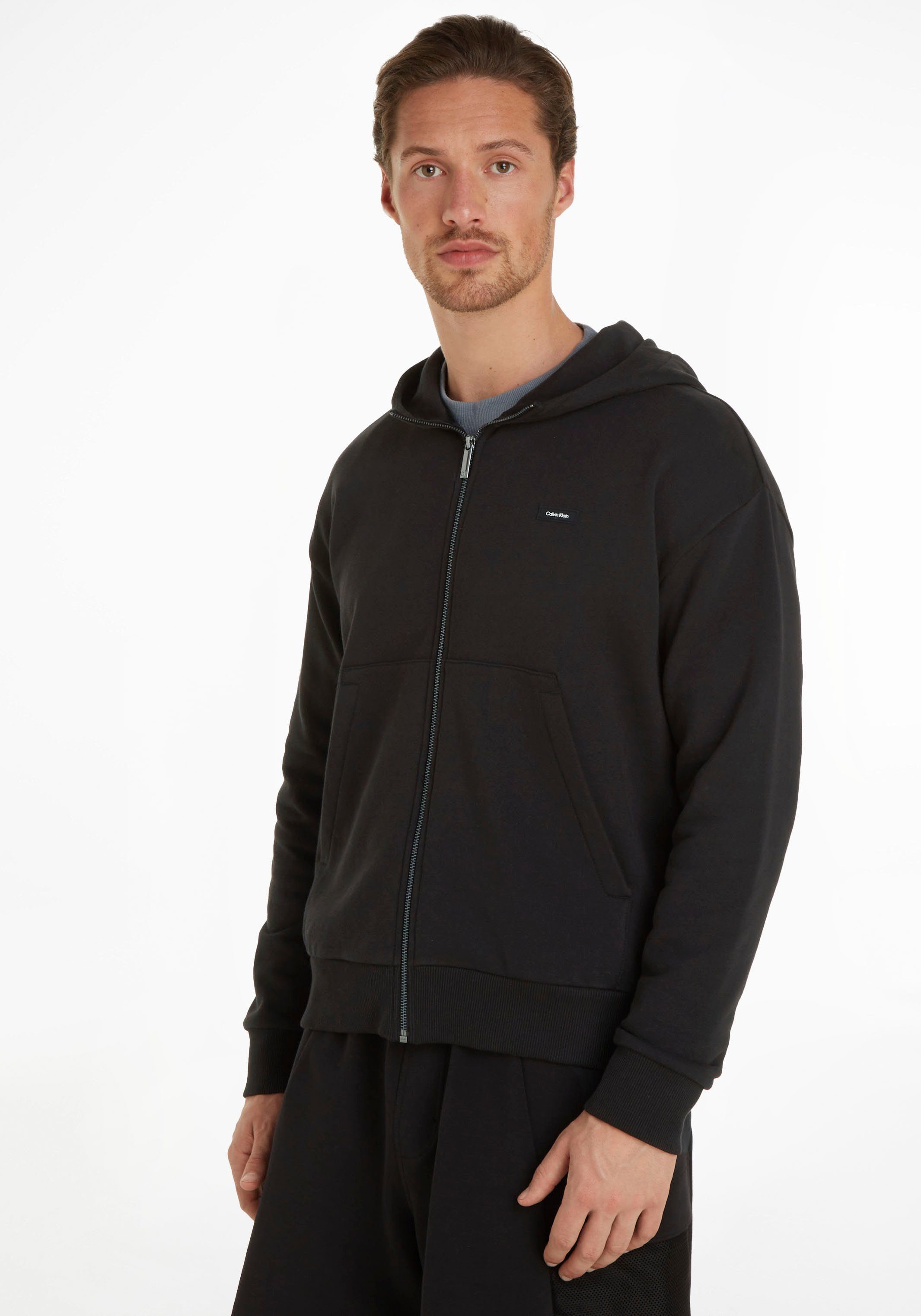 Calvin Klein Kapuzensweatshirt mit aufgenähtem CK-Badge auf der Brust