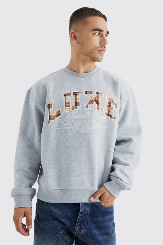 Kastiges Oversize Sweatshirt mit luxuriöser Applikation