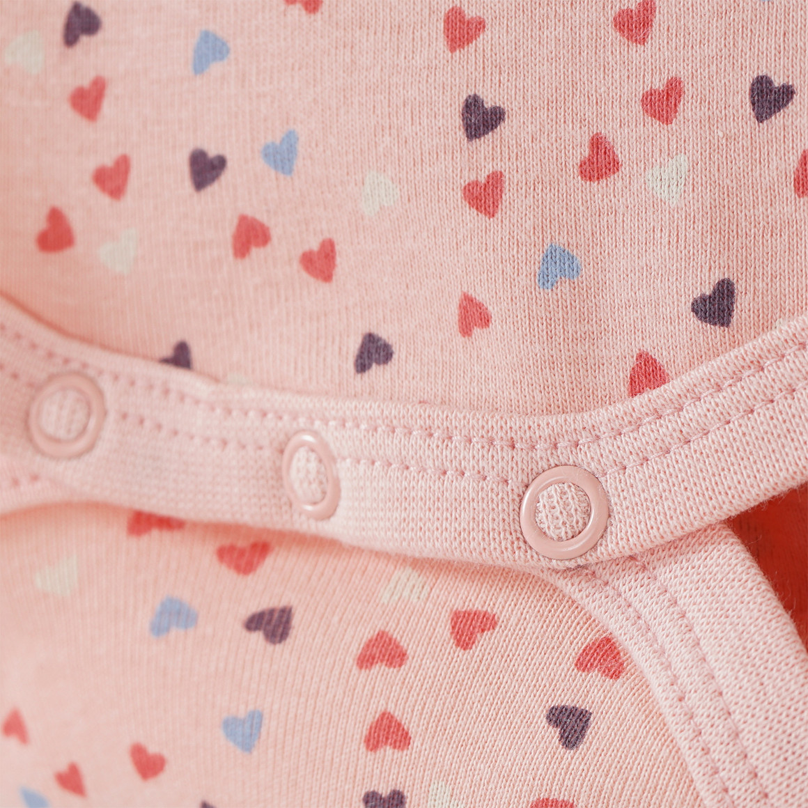 Baby Langarmbody mit Herzchen-Allover