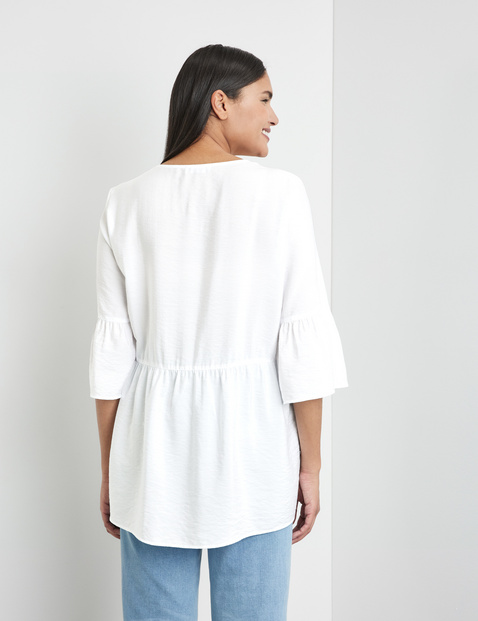 Ausgestellte Bluse mit Volants