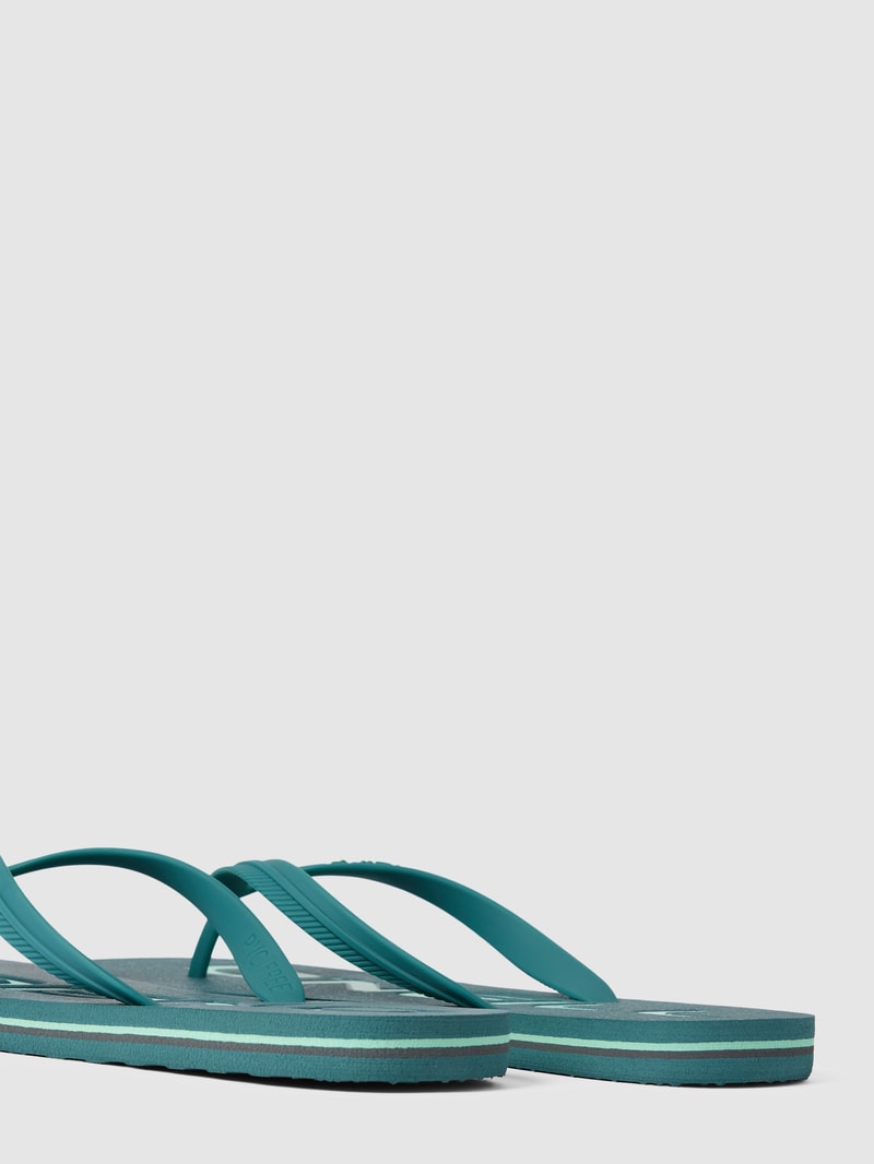 Slides mit Label-Applikation in petrol