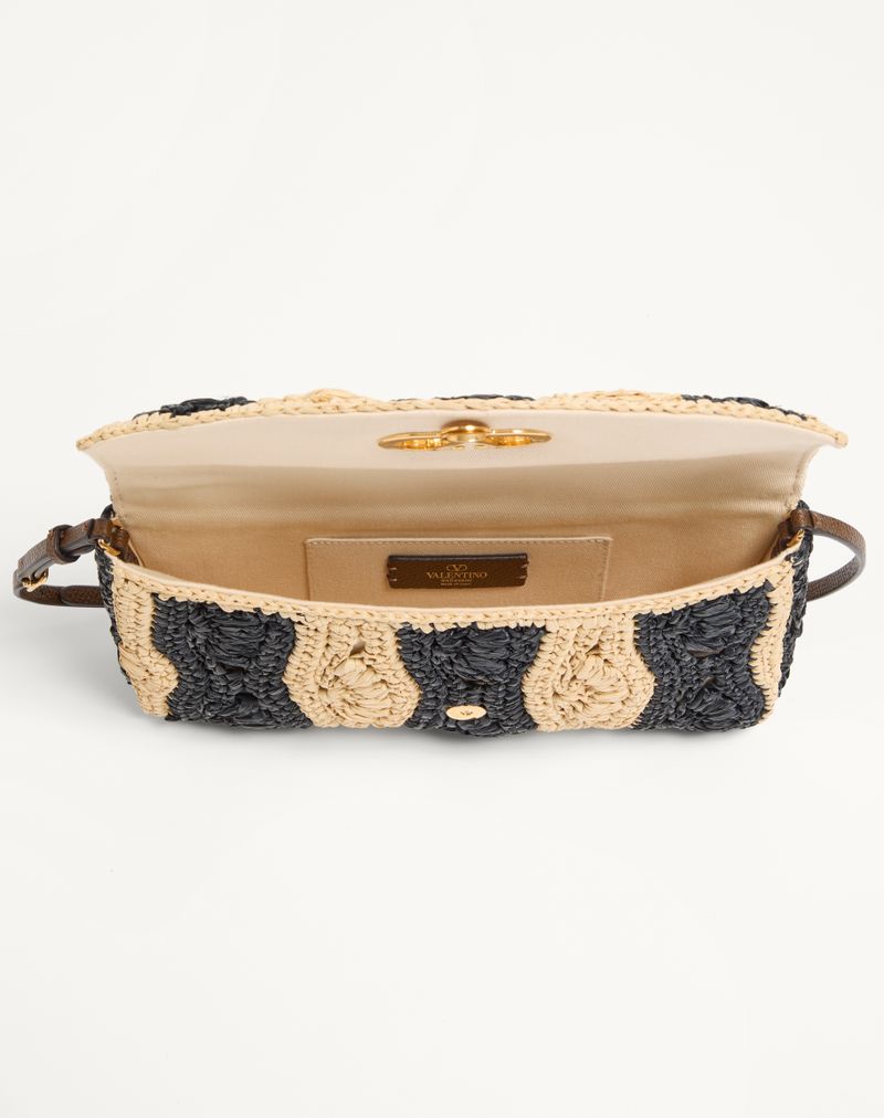 Bolsa de ombro pequena Valentino Garavani Devain em ráfia com motivo de ondas.