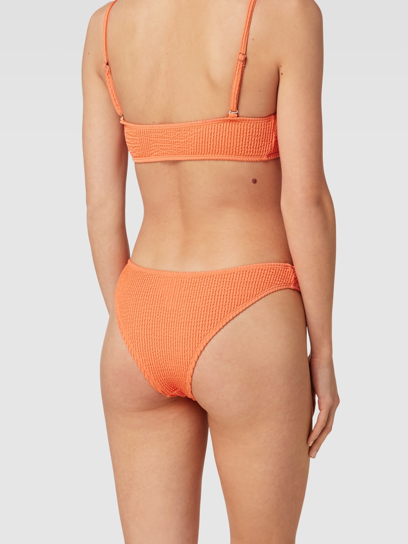 Bikini-Hose mit Strukturmuster Modell 'Audny Biddi Bikini Cheeky' in koralle