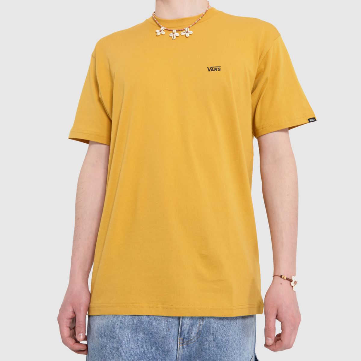 Vans-logotyp på vänster bröst i guld