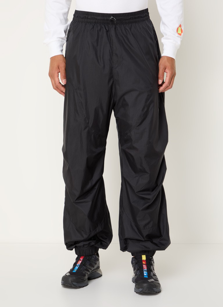 The North Face TNF x Yinka Ilori sašaurinātas bikses ar rāvējslēdzēja kabatām un logotipu