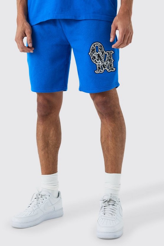 Lockere mittellange Shorts mit Applikation