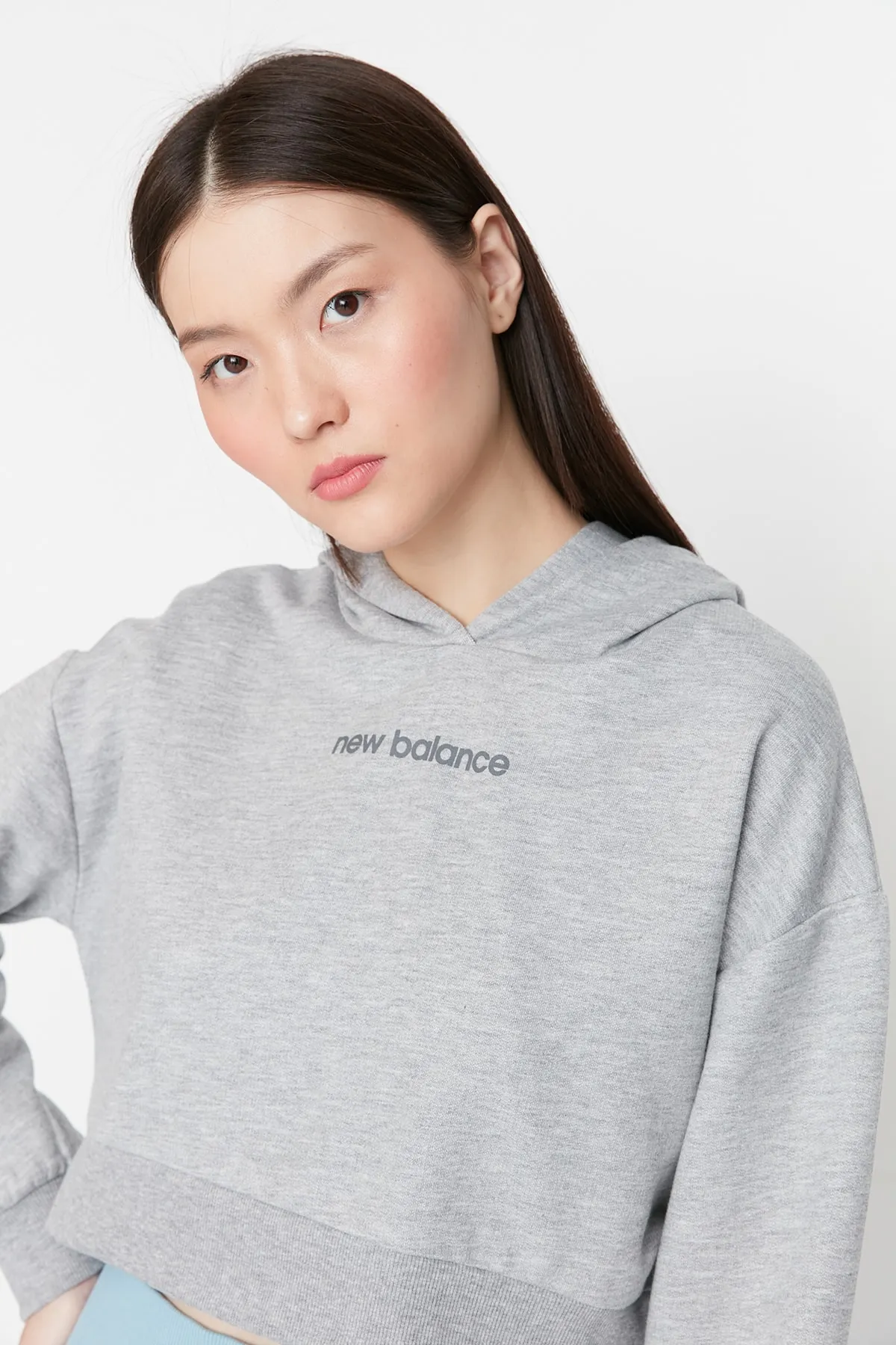 New Balance  Graues Sport-Sweatshirt für Damen WTH053-AG