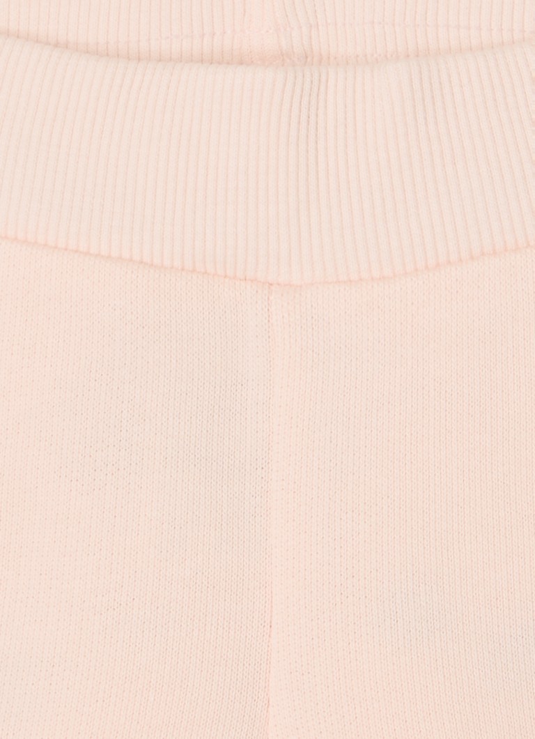 Pantaloni de trening Benetton cu croială conică și broderie.