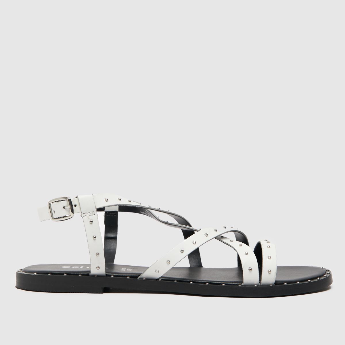Schuh Tadlow szegecses lapos talpú szandál fehér színben