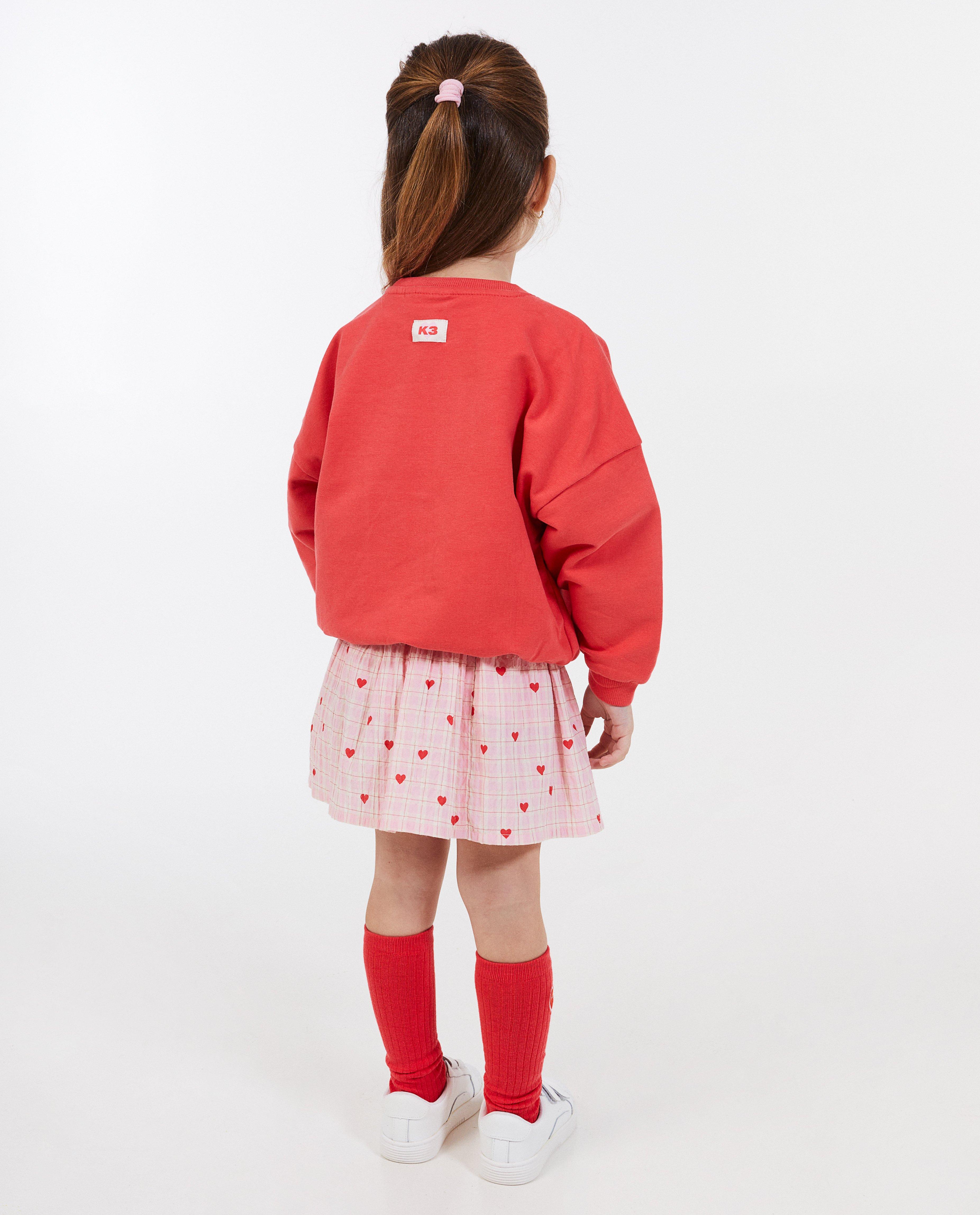 K3 Pulóver K3 De 3 Biggetjes felirattal, unisex világospiros