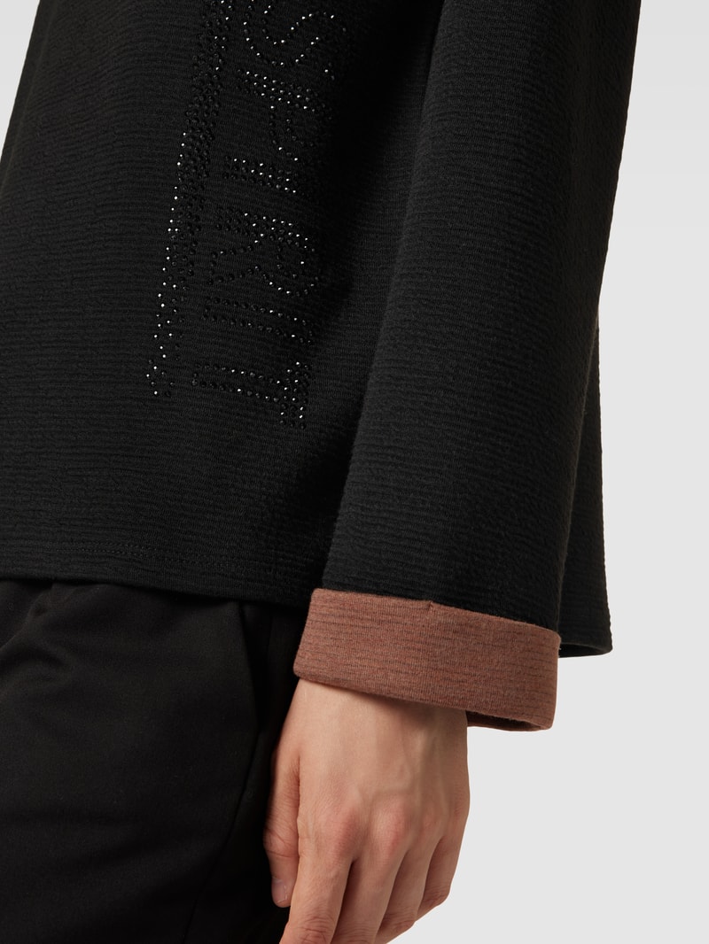 Pullover mit Ziersteinbesatz in schwarz