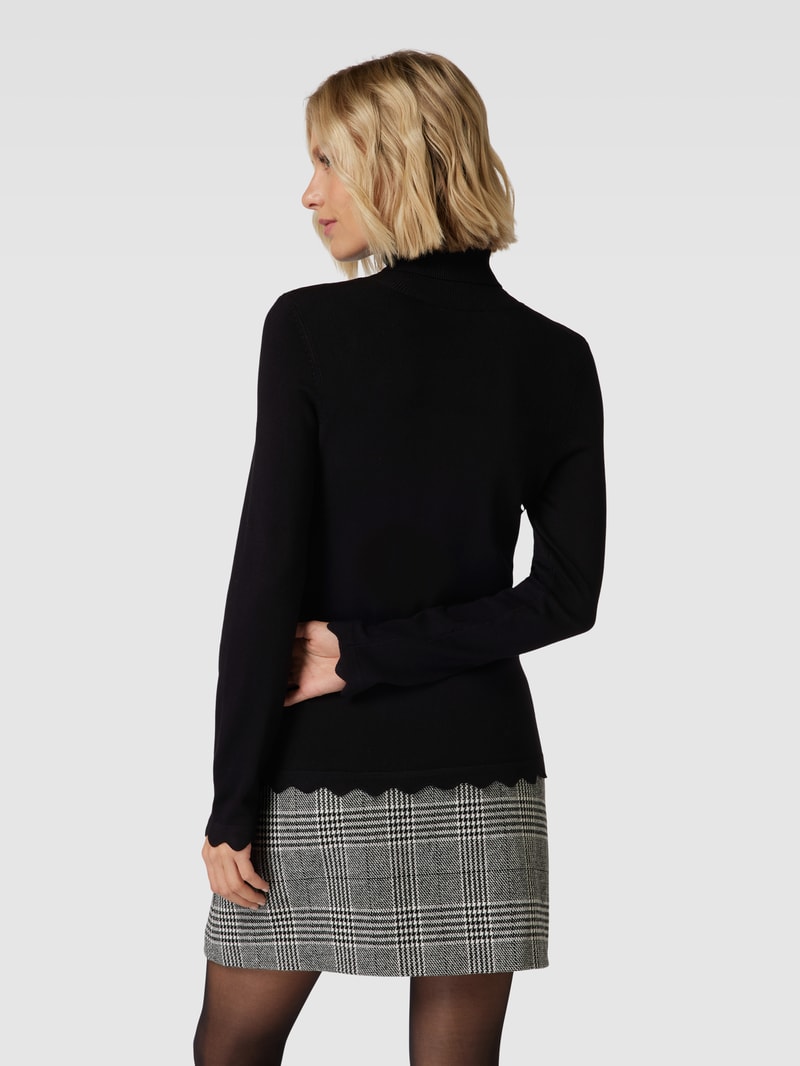 Rollkragenpullover aus Viskose-Mix mit Wellensaum in schwarz
