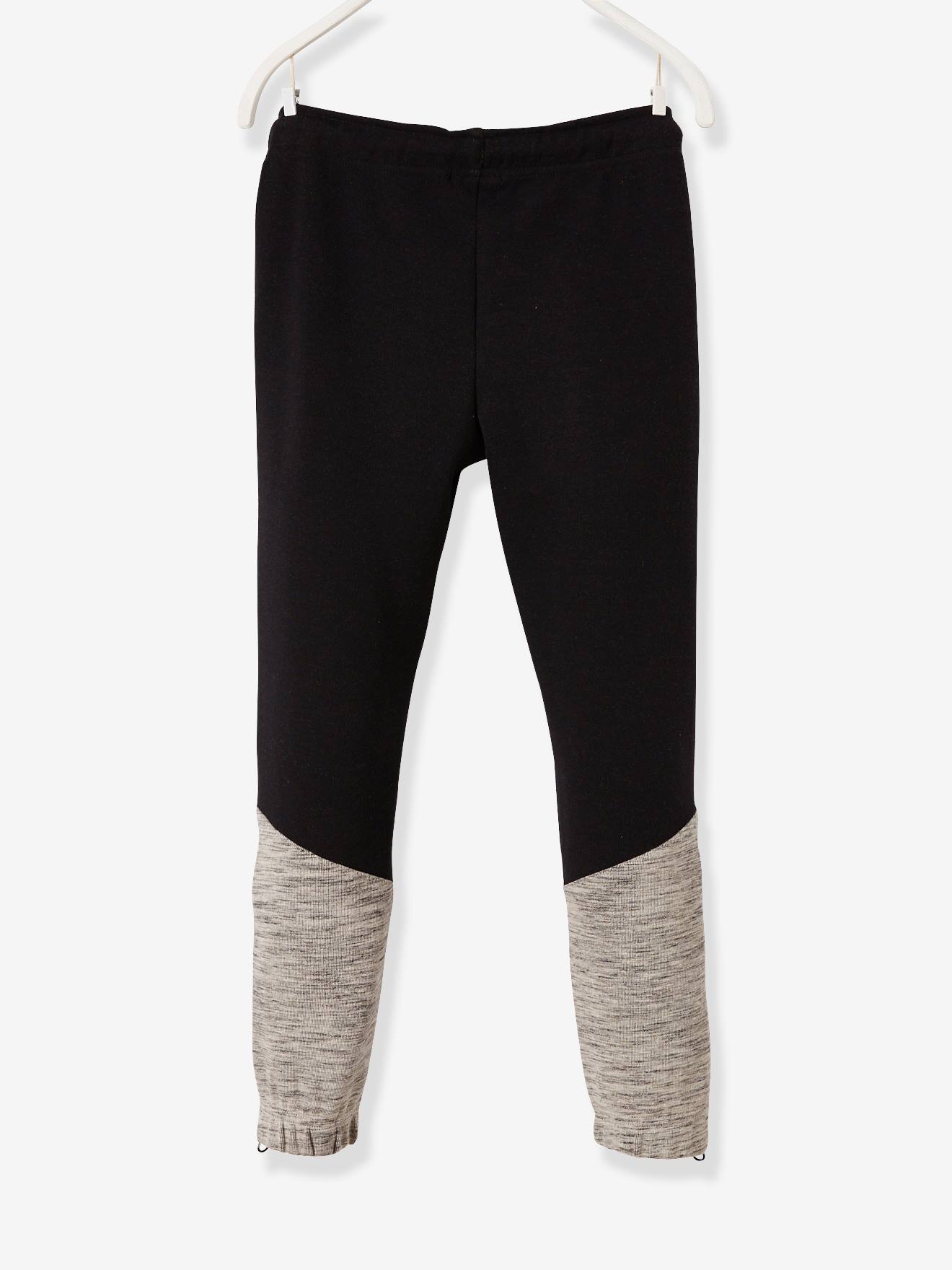 Pantalon de sport garçon en matière technique détails fluo noir