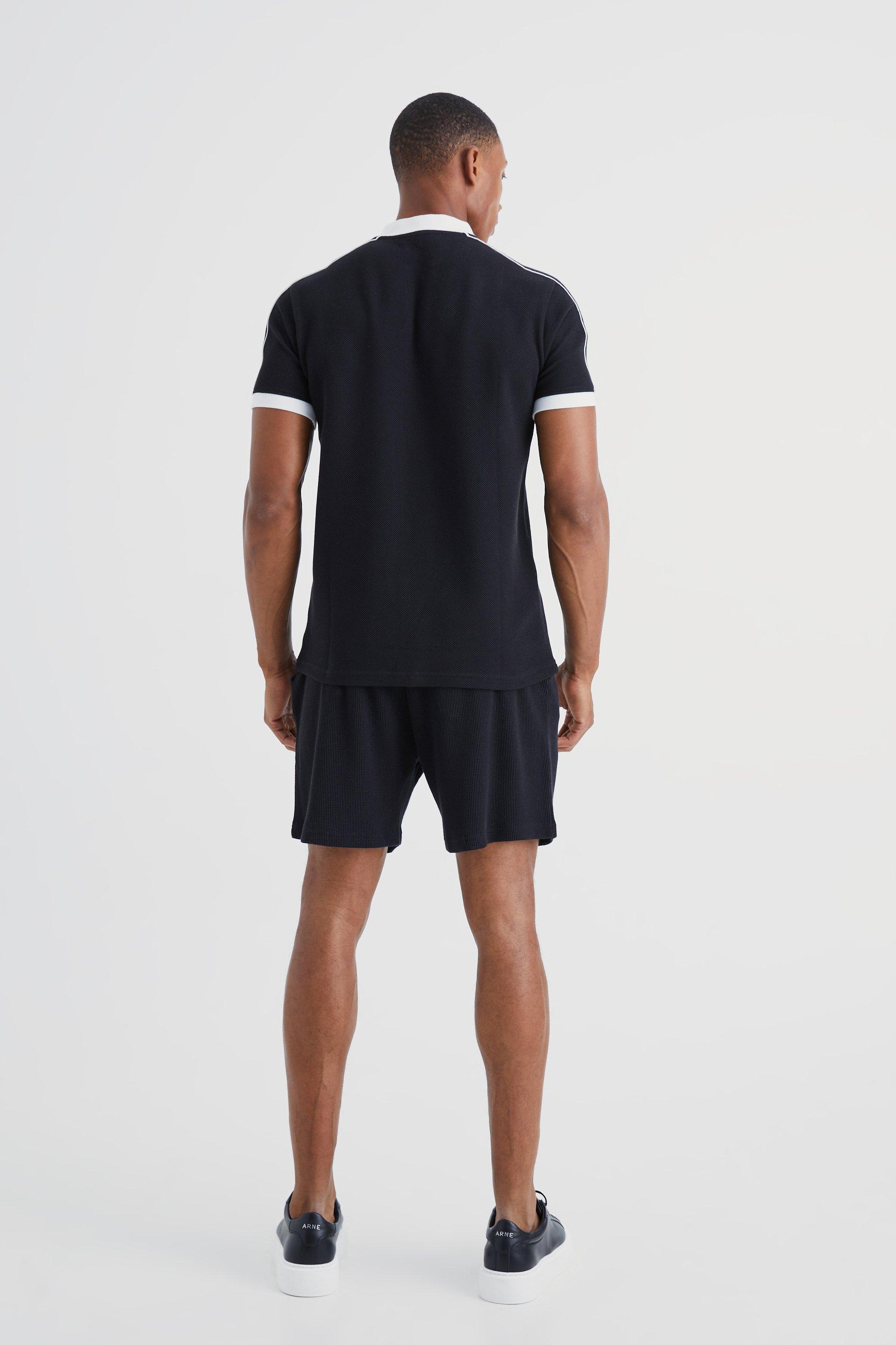 Poloshirt mit Popcorn-Textur, Bomber-Kragen und Paspeln