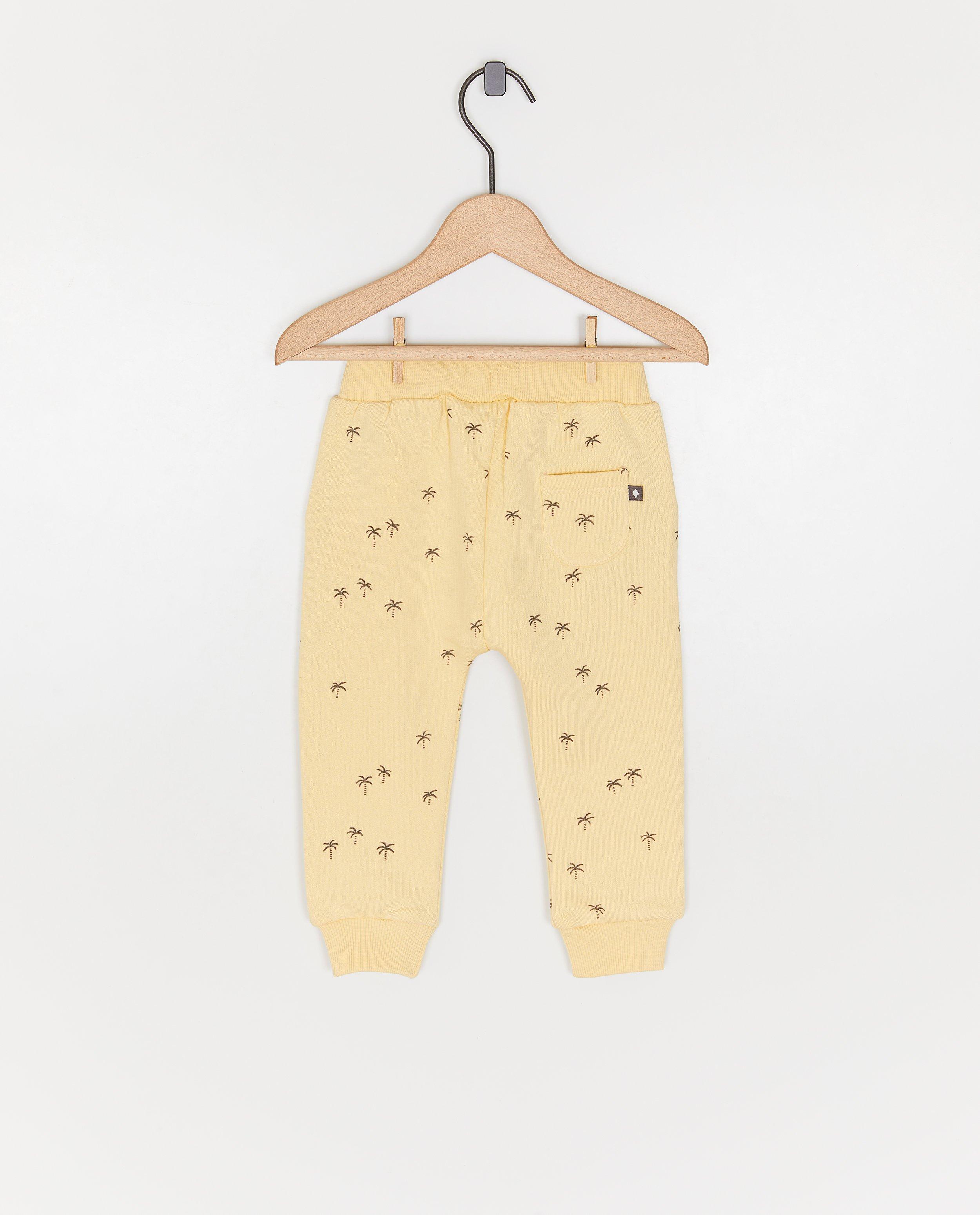 Pantaloni de trening Feetje cu imprimeu de palmieri galben deschis