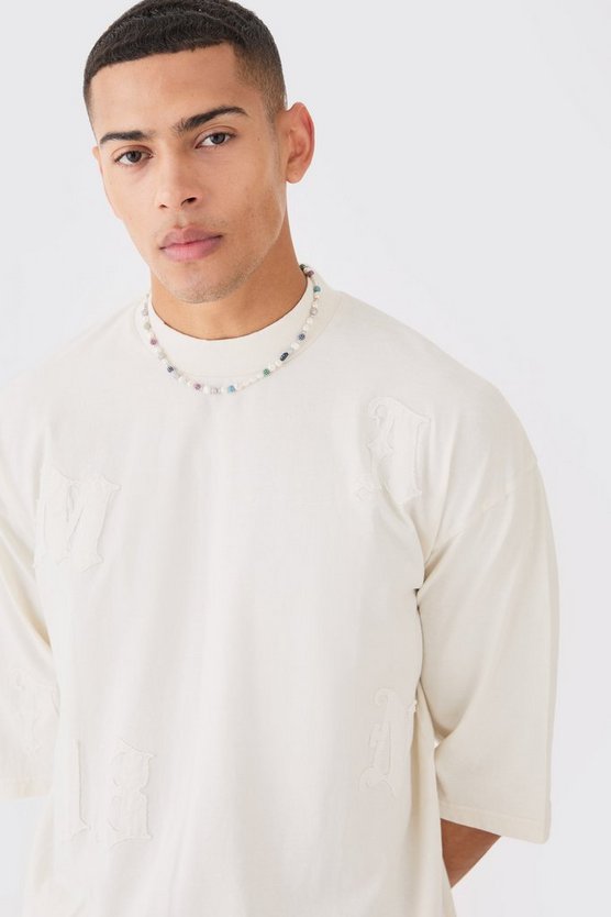 Oversize T-Shirt mit Acid-Waschung und Applikation