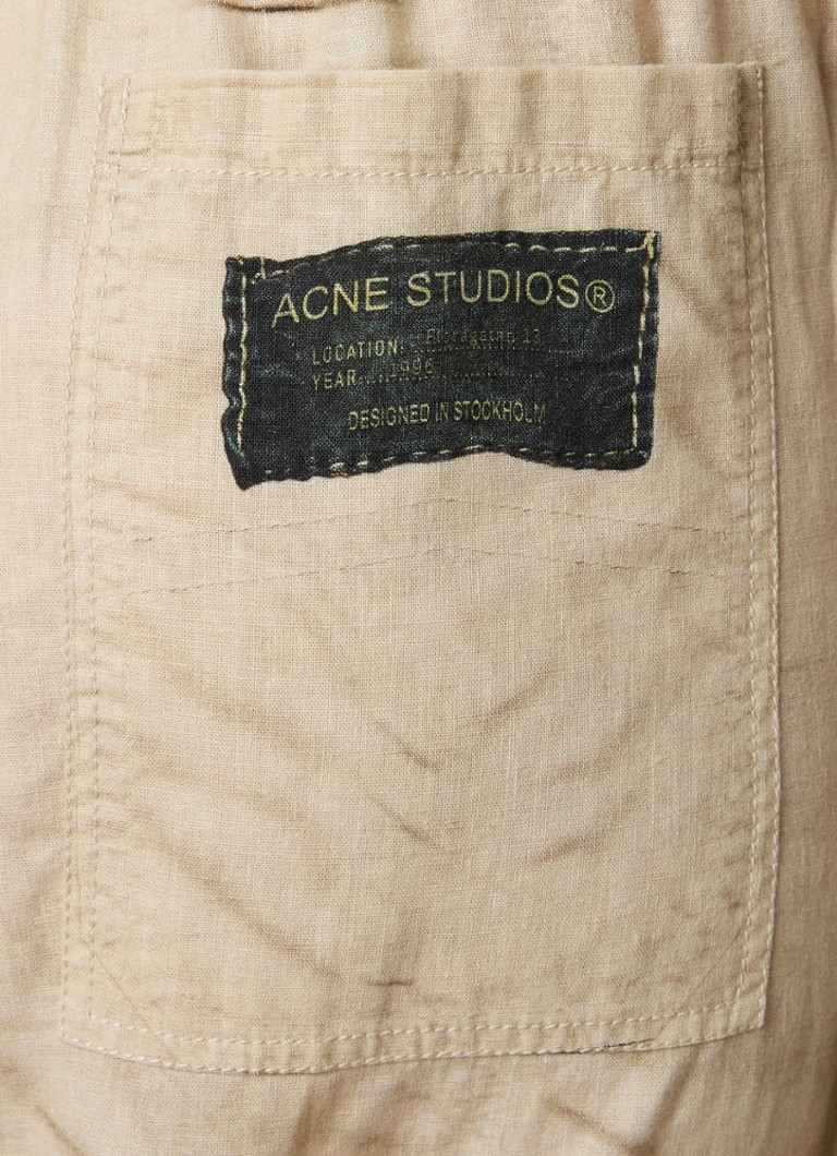 Pantaloni cargo a vita media e affusolati di Acne Studios in misto lino.