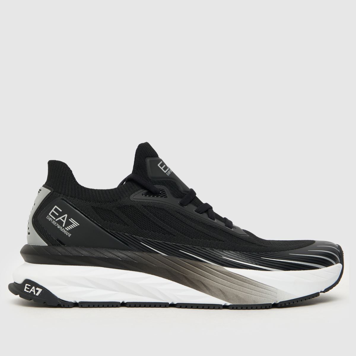 EA7 Emporio Armani – Svarta och vita stickade sneakers med Crusher Distance-logotyp