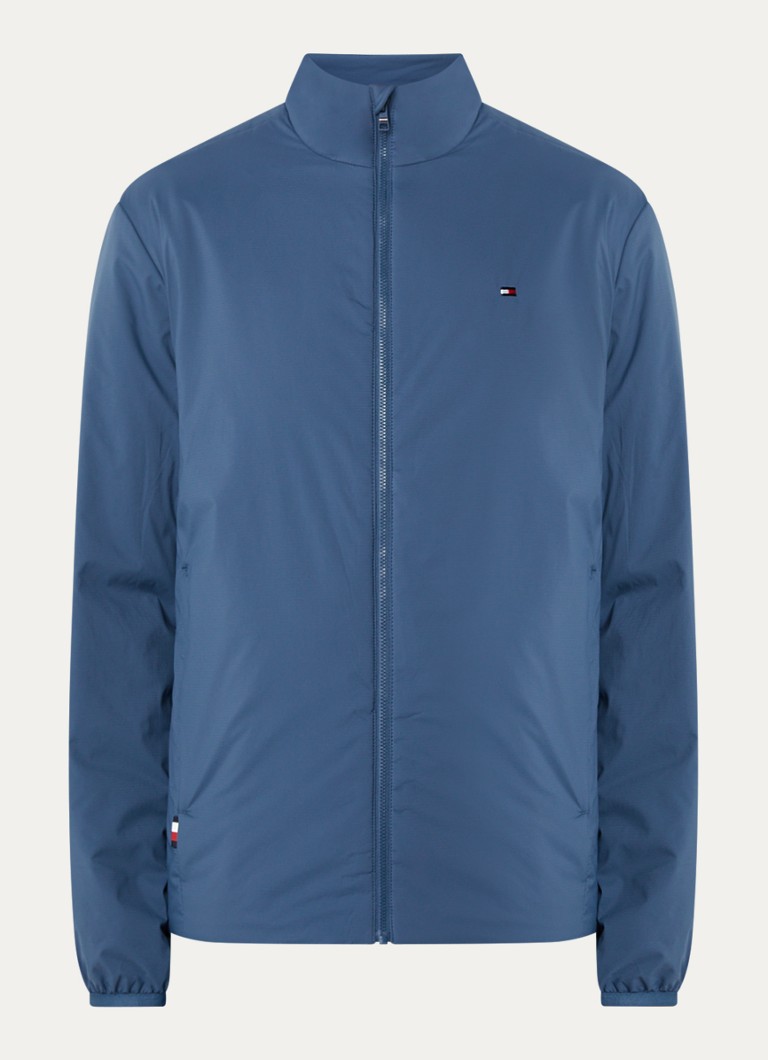 Pršiplášť Tommy Hilfiger s logom a vreckami na zips