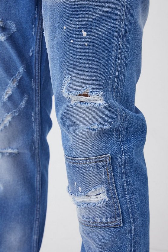 Slim-Fit Jeans mit Farbdetail und Riss am Knie