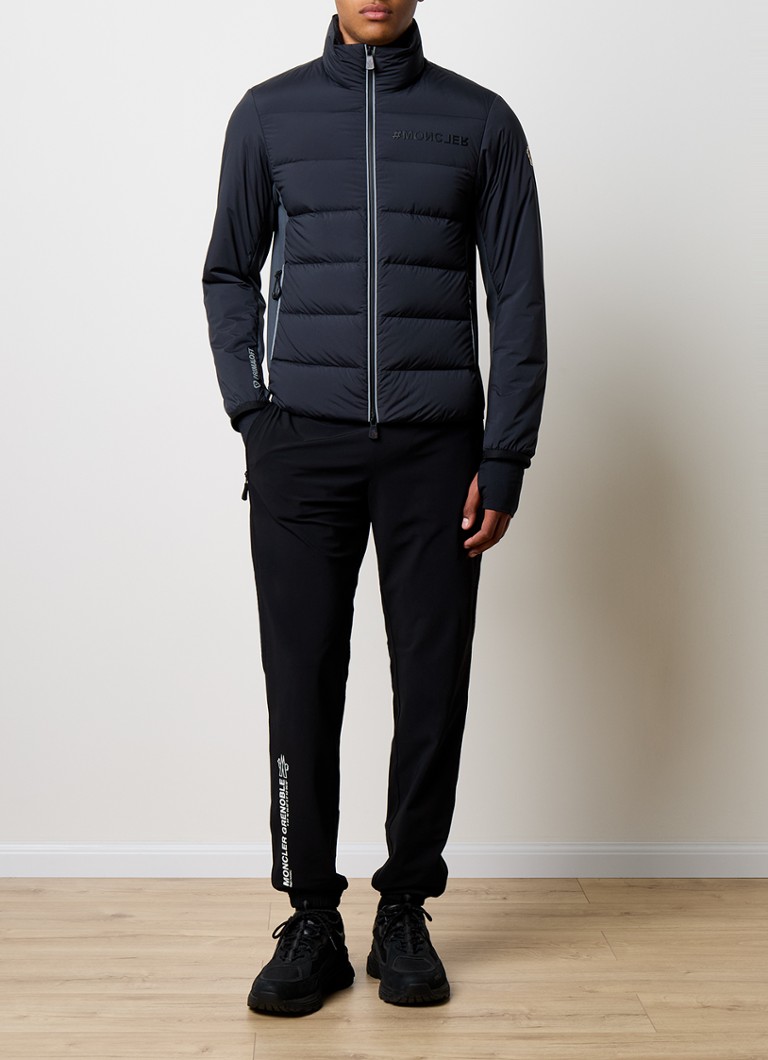 Giacca imbottita Moncler Pocol con imbottitura in piuma e tasche con cerniera.