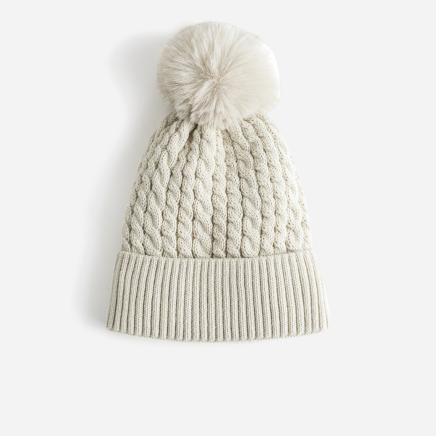 Bonnet TEXTO beige en tricot torsadé à pompon