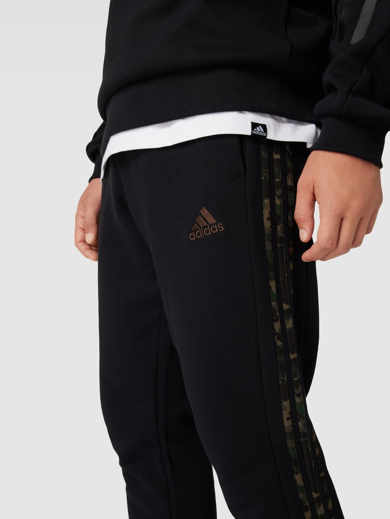 Jogpants mit elastischem Bund und Tunnelzug in schwarz
