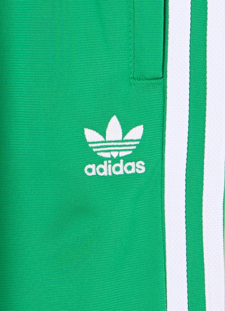Pantaloni da tuta Adidas a gamba affusolata con logo ricamato
