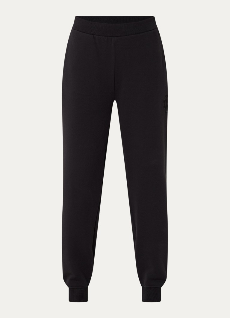 Pantaloni de trening Calvin Klein cu talie înaltă, cu croială conică pe picioare și buzunare laterale.