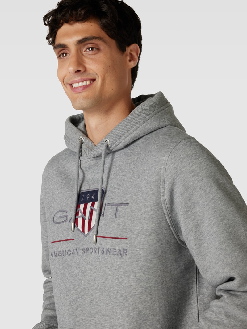 Hoodie mit Label-Stitching Modell 'ARCHIVE SHIELD' in silber meliert