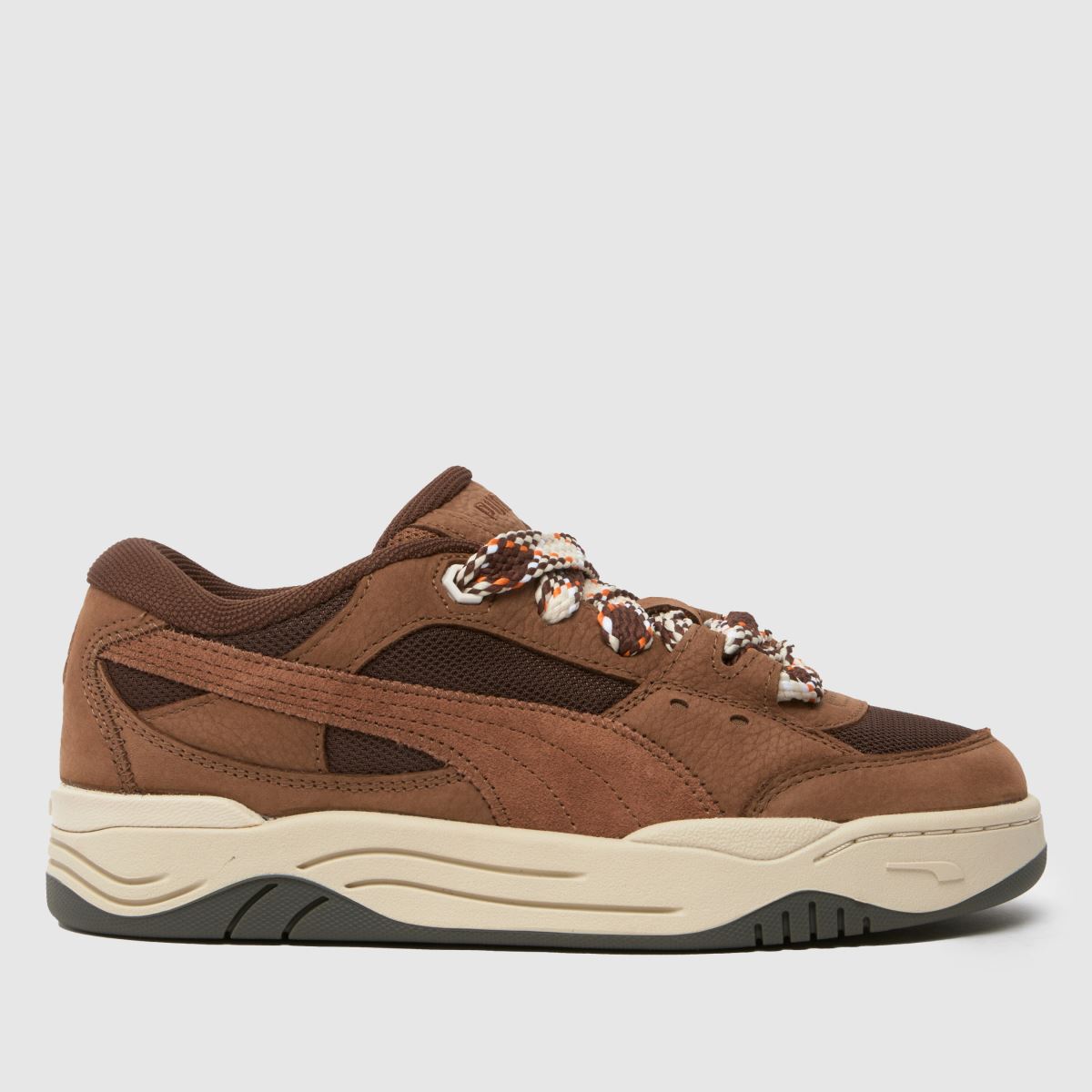 PUMA – 180 – Bruna, flerfärgade sneakers med spetsmotiv
