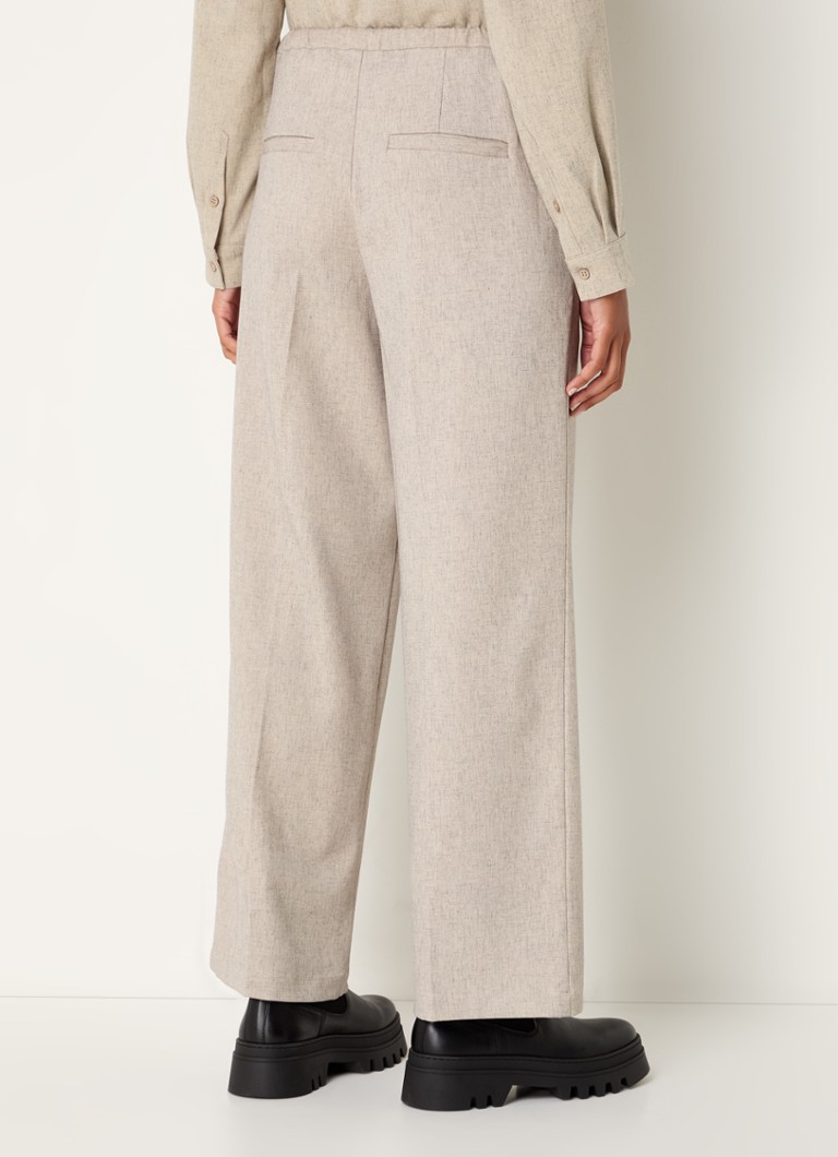 Pantaloni Kalem di Modström a vita media e taglio dritto, realizzati in misto lino con tasche laterali.