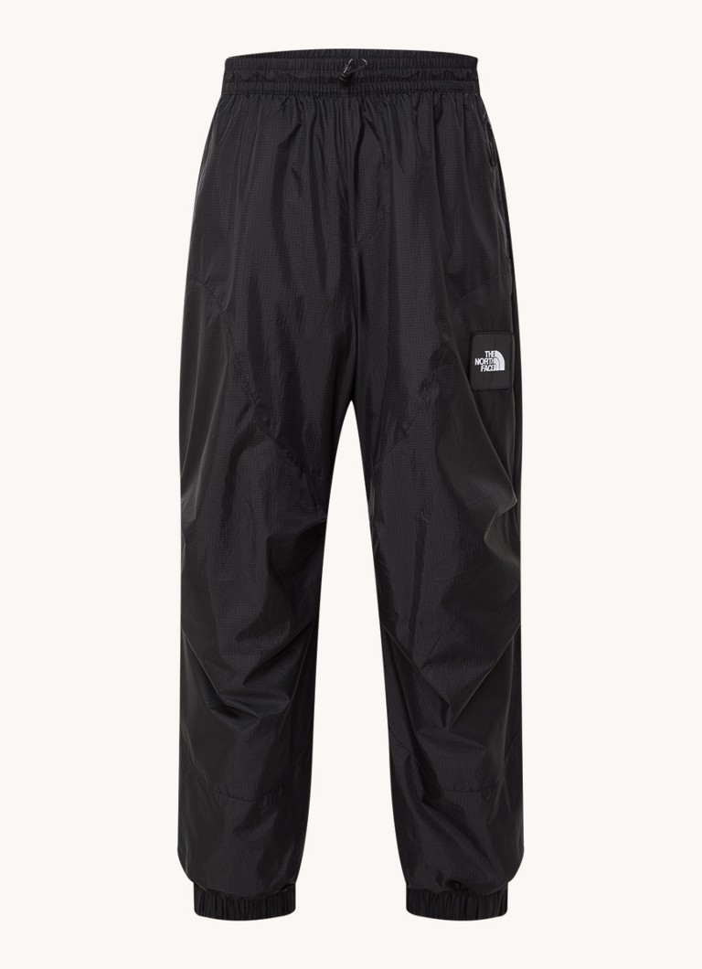 The North Face TNF x Yinka Ilori sašaurinātas bikses ar rāvējslēdzēja kabatām un logotipu