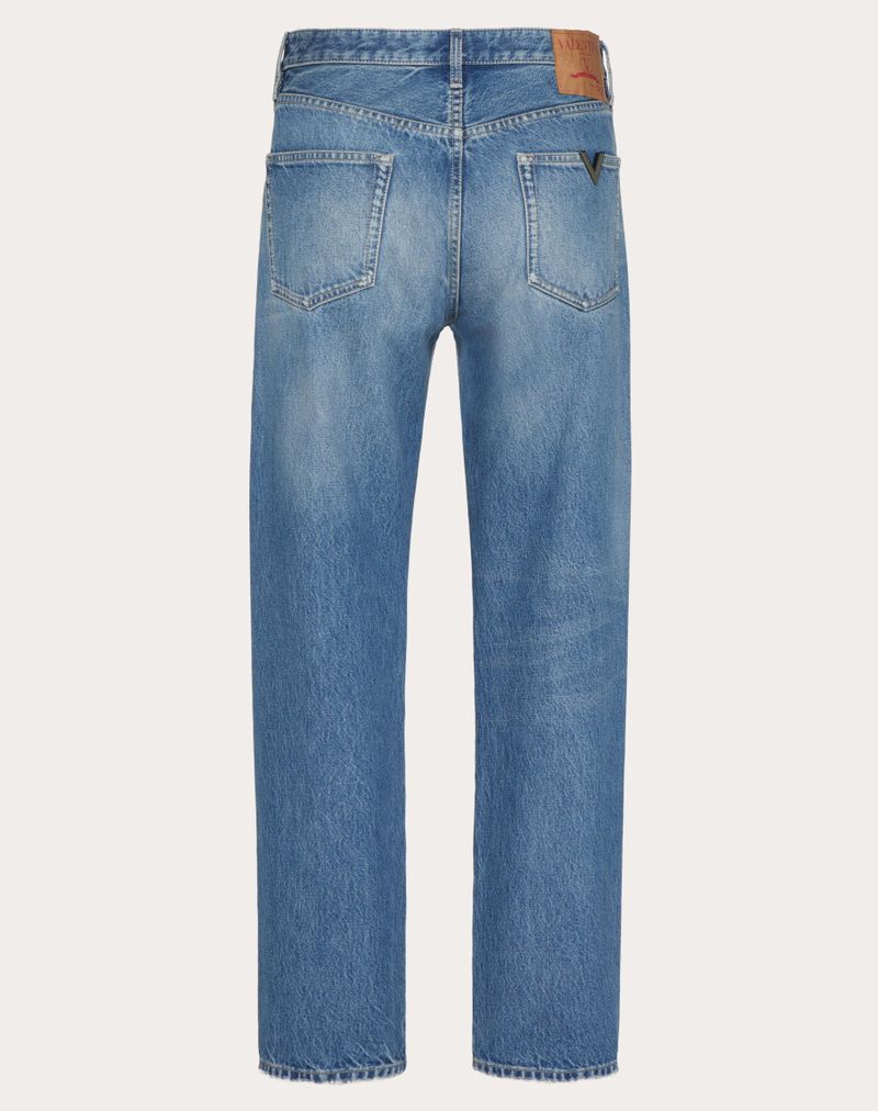 Denimbukser med metallisk V-detalje