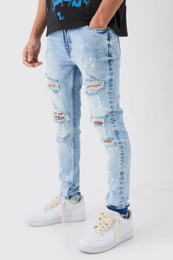 Zerrissene Skinny Stretch Jeans mit Farbspritzern