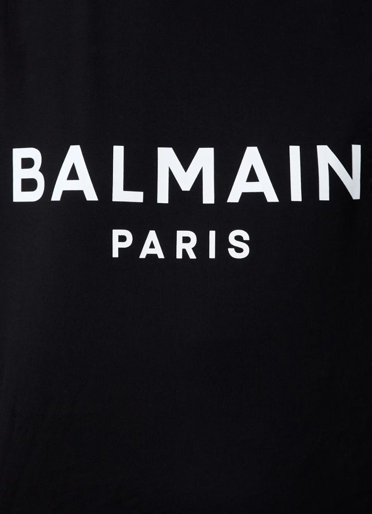 Balmain Sleeveless top with decorative buttons and logo print