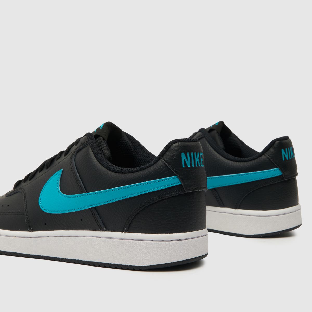 Športni copati Nike Court Vision v črni in modri barvi